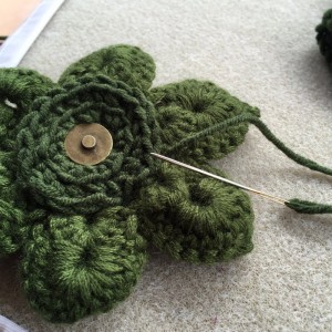 Sew on prepared magnetic button to back of flower