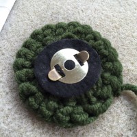 Securing magnetic button to backing felt and crochet circle