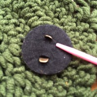Sew on prepared magnetic button to back of flower